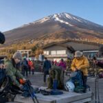 Hikers preparing gear at Mt. Fuji 5th Station for climbing season