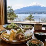 A lighter Japanese meal with vegetables, tofu, rice, and Mt. Fuji outside