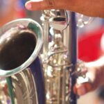 A saxophonist performing outdoors for the Fuji Five Lakes Jazz Festival schedule update