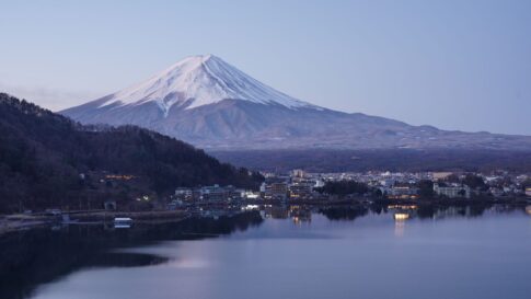 Mount Fuji with a soft sky and lake-area foreground for How to Check Mt. Fuji Visibility Before Leaving Tokyo