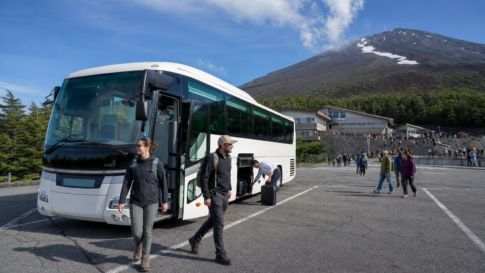 Travelers arriving by highway coach at the Fuji Subaru Line 5th Station