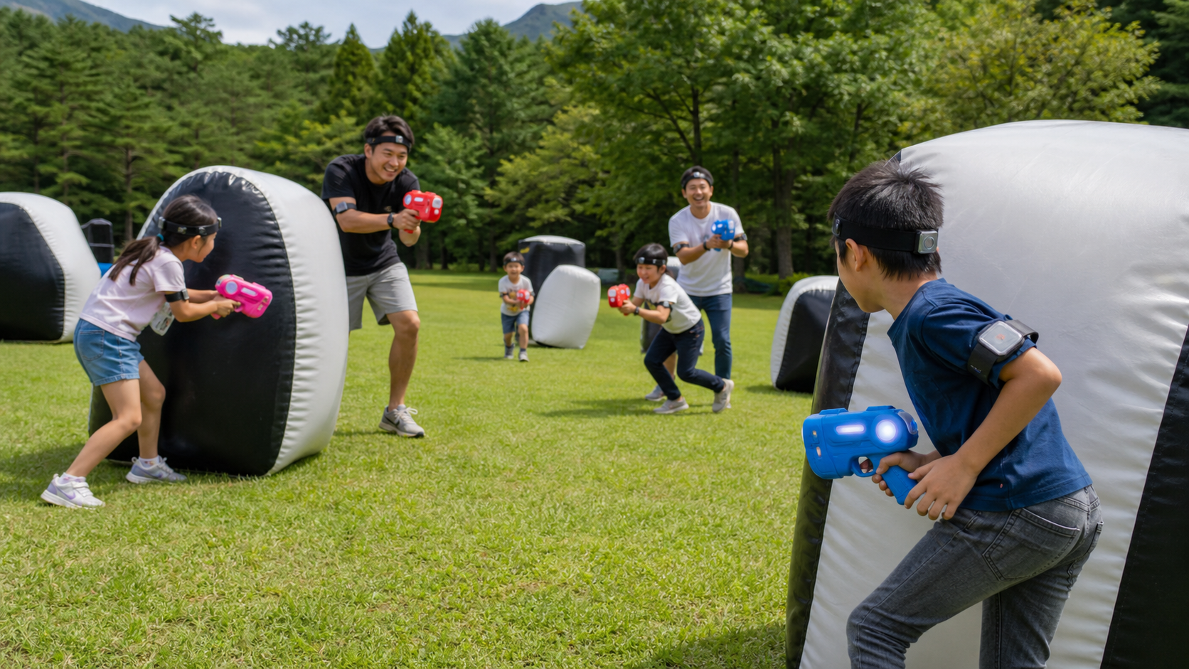 Text-free families playing a safe outdoor infrared tag game with colorful toy devices in a forest park