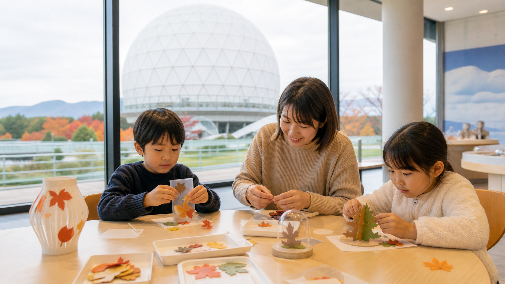 Text-free family making autumn crafts in a museum lobby with a white radar dome outside