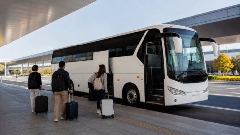 Text-free highway coach boarding travelers with luggage at a Japanese airport terminal