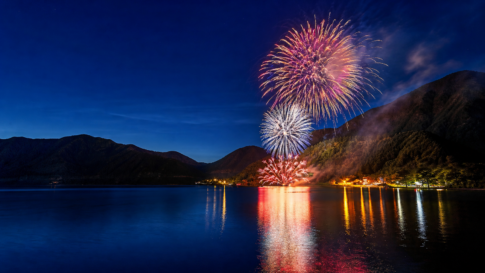 Fireworks over Lake Motosuko and surrounding mountain ridges