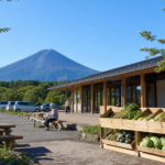 Travelers taking a summer break at a roadside station below Mount Fuji