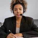 Customer support agent wearing a headset and ready to assist inquiries