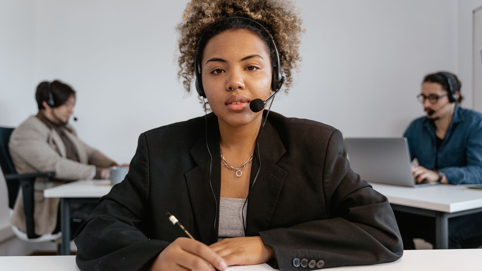 Customer support agent wearing a headset and ready to assist inquiries