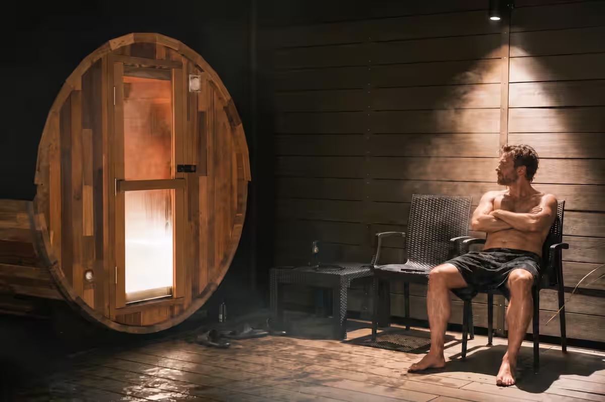 Barrel sauna and outdoor cooldown area at KINFOLK YAMANAKAKO at night