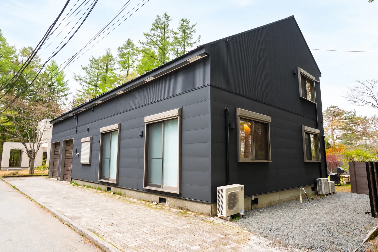 Black exterior of KINFOLK YAMANAKAKO at check-in