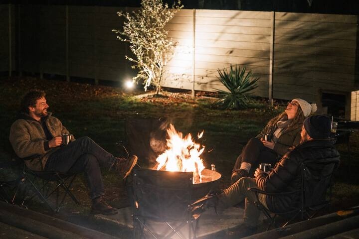 Friends sitting around the firepit in the garden at KINFOLK YAMANAKAKO