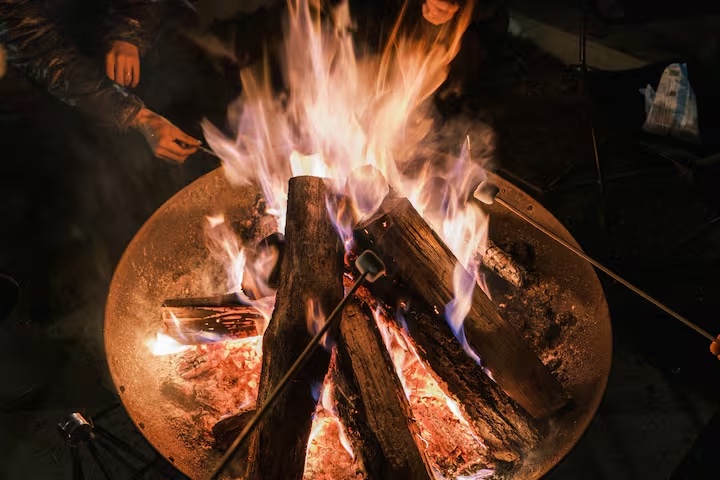 Marshmallows roasting over the firepit at KINFOLK YAMANAKAKO