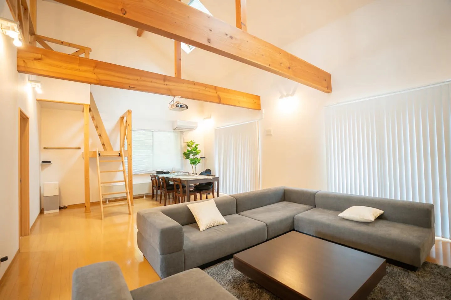 Open living and dining room inside KINFOLK YAMANAKAKO