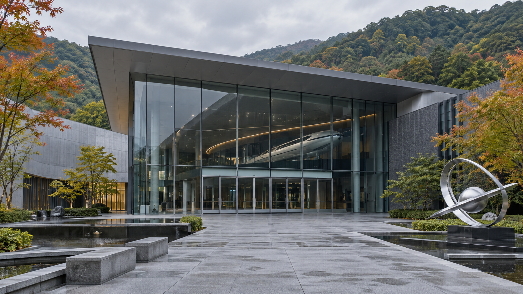 A quiet modern science museum entrance with an abstract high-speed transport exhibit inside